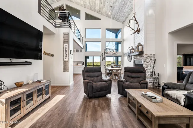 a kitchen with stainless steel appliances a sink stove and cabinets