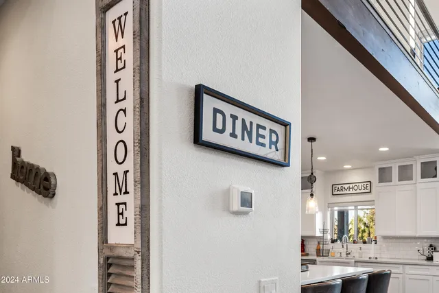 a view of a roof deck with couches and wooden floor
