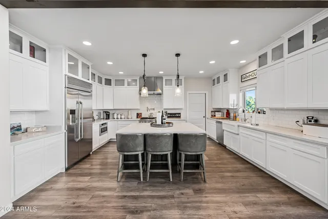 a view of a chairs and table in a balcony