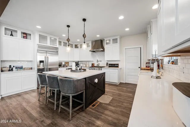 a view of a backyard with sitting area