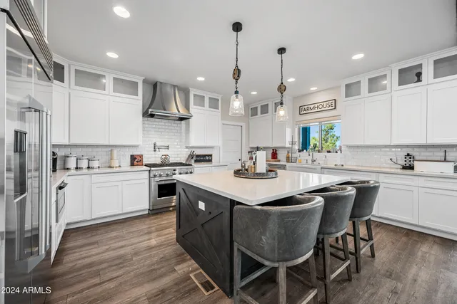 a view of a big house with a big yard and large trees