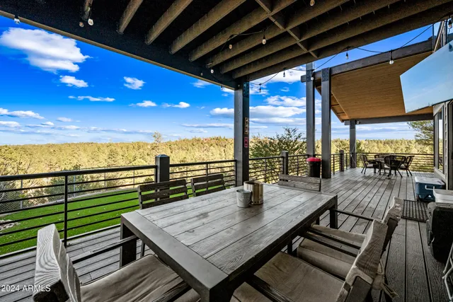 a view of a balcony with wooden floor