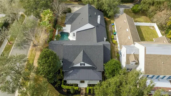 a kitchen with stainless steel appliances granite countertop a sink a stove a table and chairs