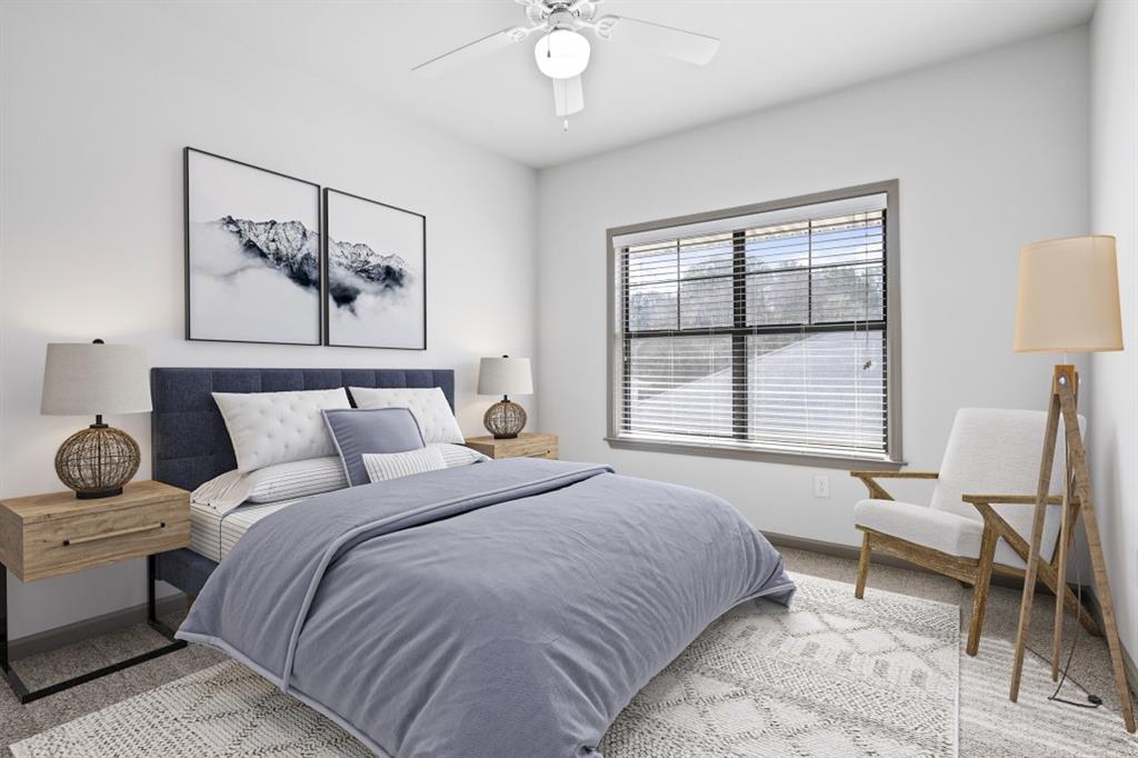 2000 Monroe Place Northeast, Unit 1306 Atlanta, GA 30324 - Photo 5 of 18 a bedroom with a bed and a large window