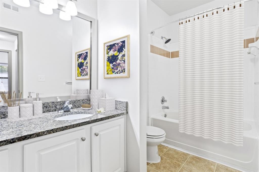 2000 Monroe Place Northeast, Unit 1306 Atlanta, GA 30324 - Photo 7 of 18 a bathroom with a granite countertop sink toilet and shower