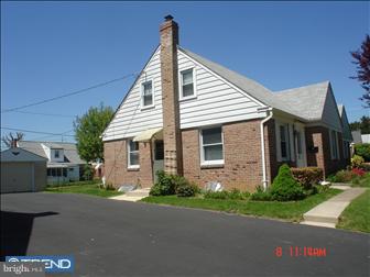 508 Bonsall Road Ridley Park, PA 19078 - Photo 2 of 6 a front view of a house with a yard and potted plants