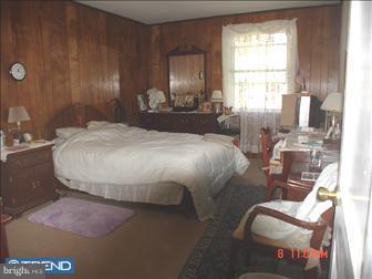 508 Bonsall Road Ridley Park, PA 19078 - Photo 4 of 6 a bedroom with a bed and chair