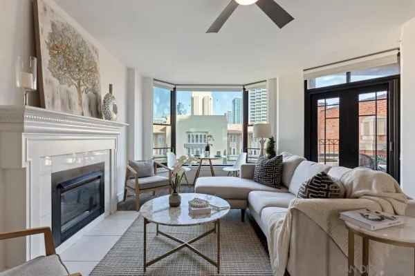 a living room with furniture and a fireplace