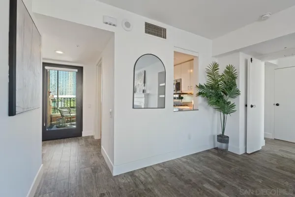 a view of entryway with livingroom and wooden floor