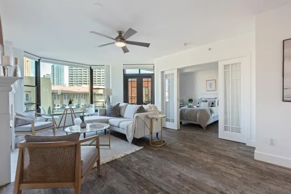 a living room with furniture and a large window