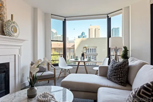 a living room with furniture and a fireplace