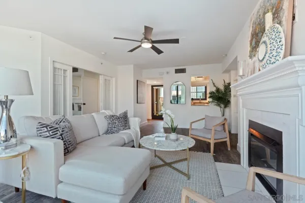 a living room with furniture and a fireplace
