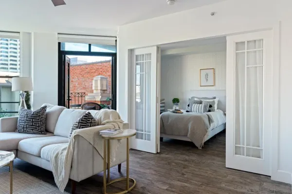 a bedroom with furniture and a window