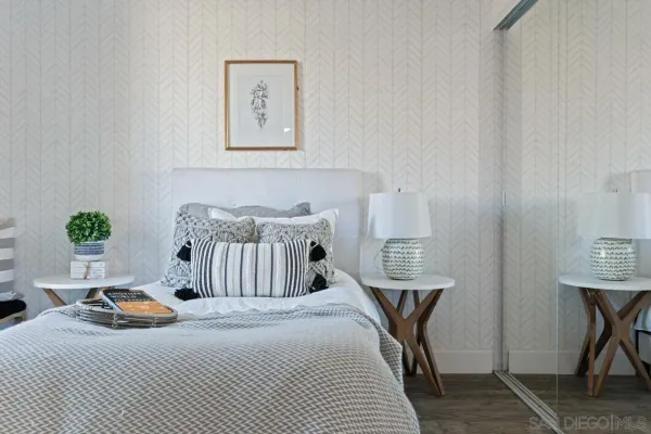 a bedroom with bed and a window