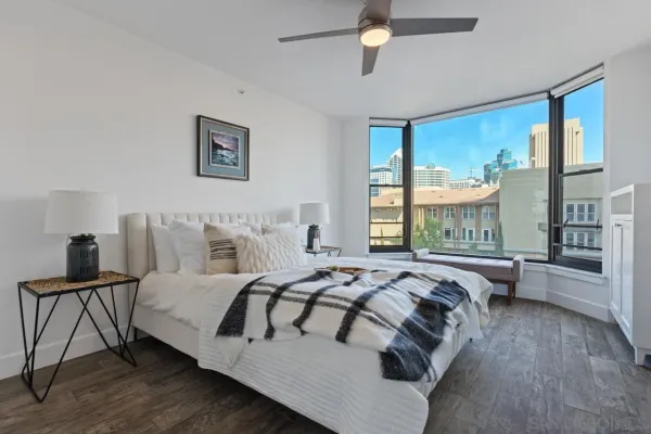 a bedroom with a bed and a window