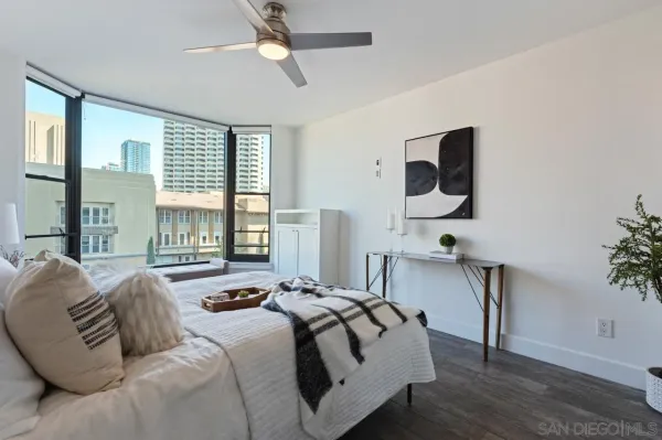 a bedroom with a bed and window