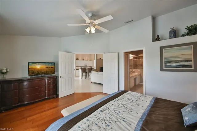 a bedroom with a bed and dresser