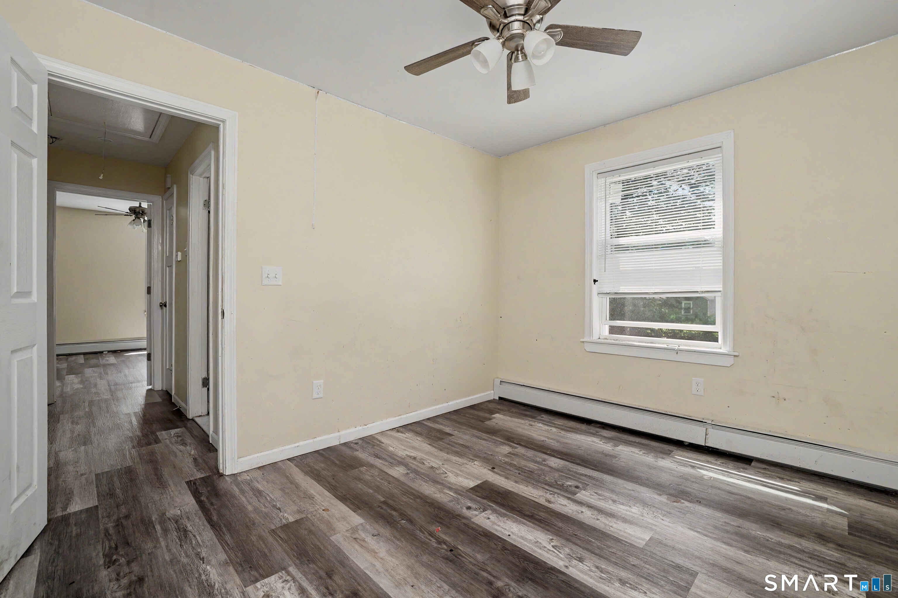 97 Boothbay Street Bloomfield, CT 06002 - Photo 29 of 33 a view of a big room with wooden floor and chandelier fan