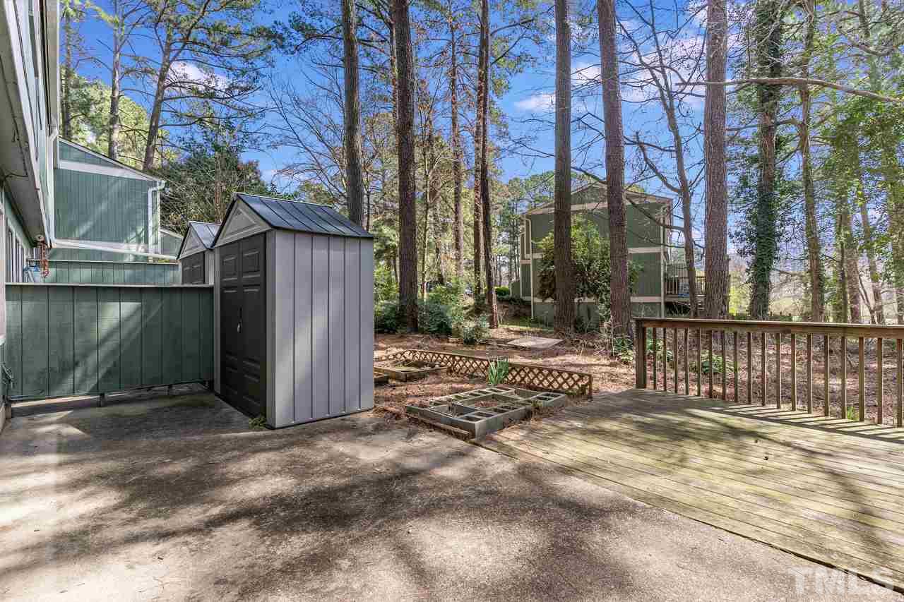 707 Godwin Court Raleigh, NC 27606 - Photo 24 of 26 a view of a house with a fence