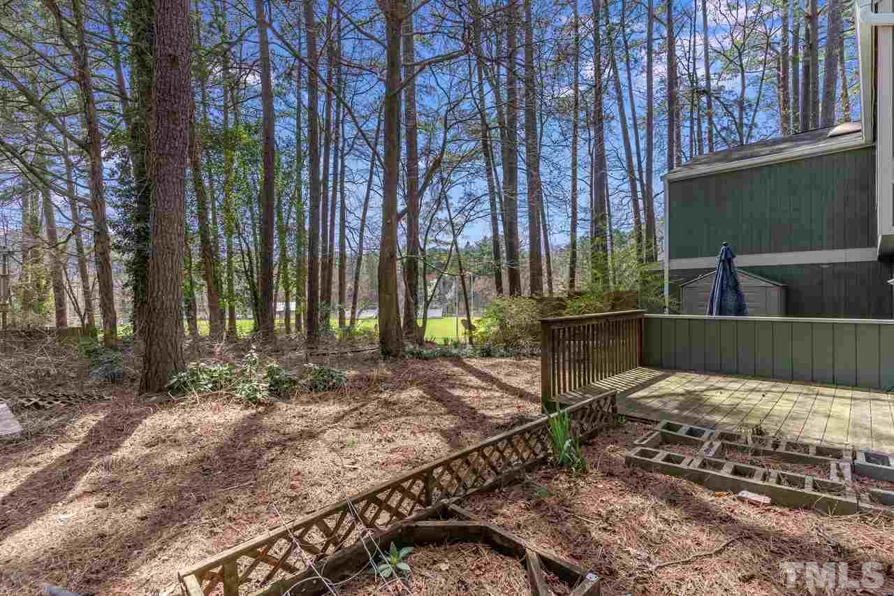 707 Godwin Court Raleigh, NC 27606 - Photo 25 of 26 a view of a backyard with tree