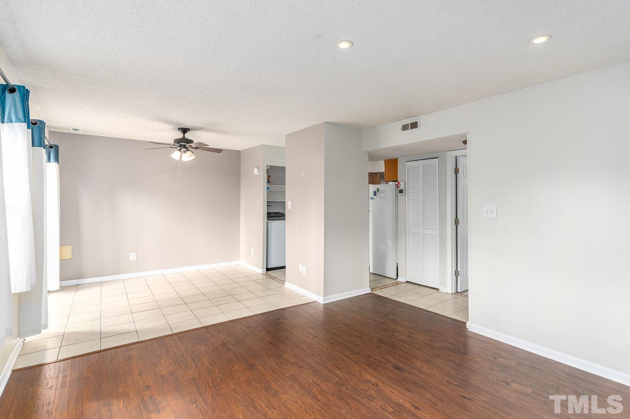 707 Godwin Court Raleigh, NC 27606 - Photo 5 of 26 a view of an empty room with wooden floor