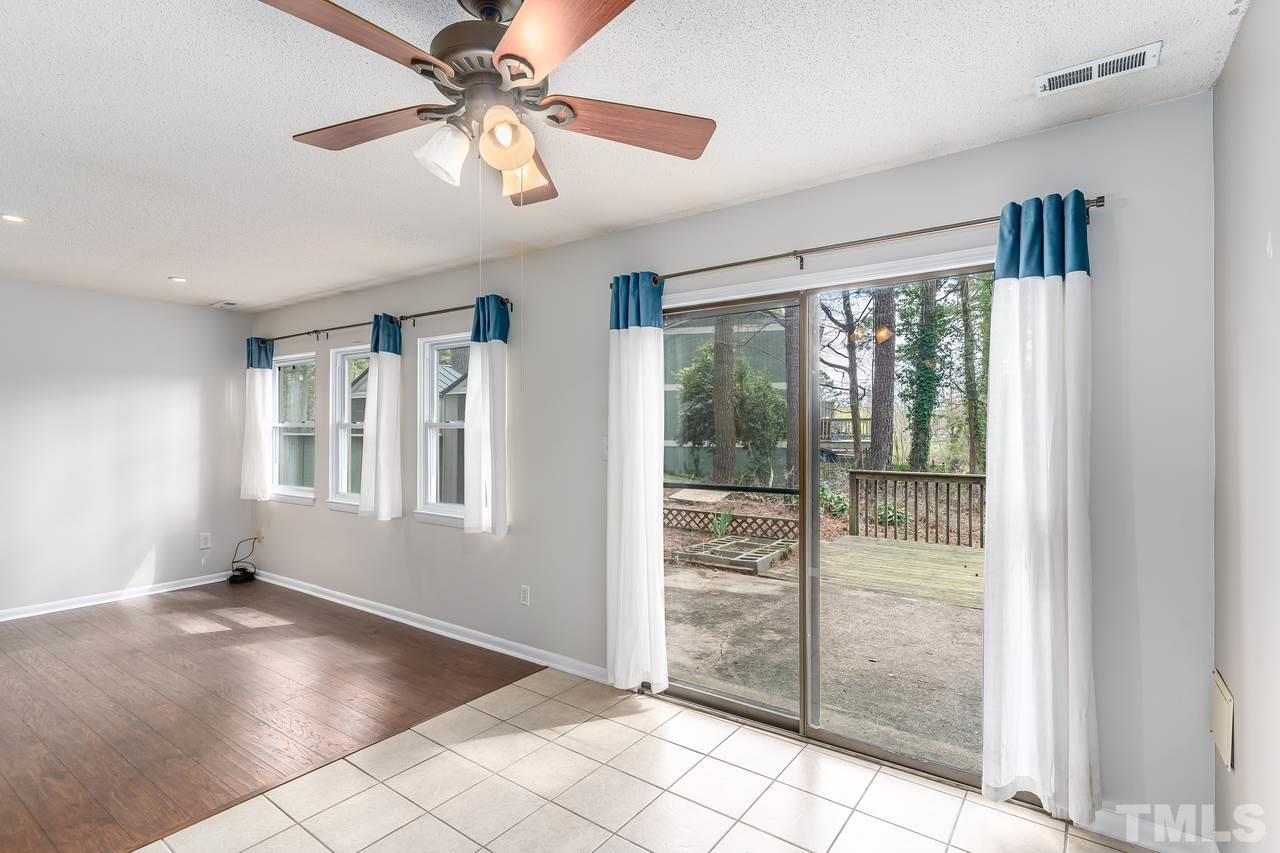 707 Godwin Court Raleigh, NC 27606 - Photo 7 of 26 a view of a livingroom with a ceiling fan and window
