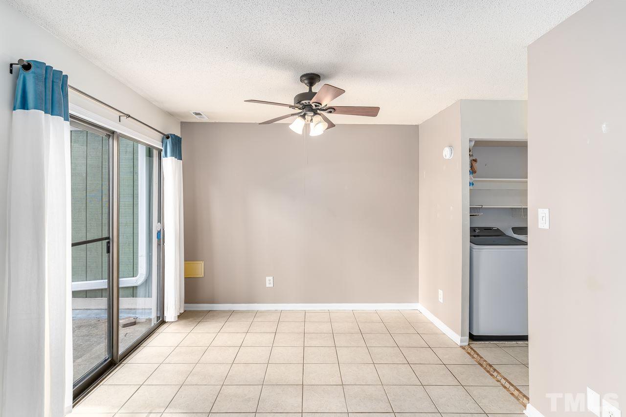 707 Godwin Court Raleigh, NC 27606 - Photo 9 of 26 a view of an empty room and window chandelier fan