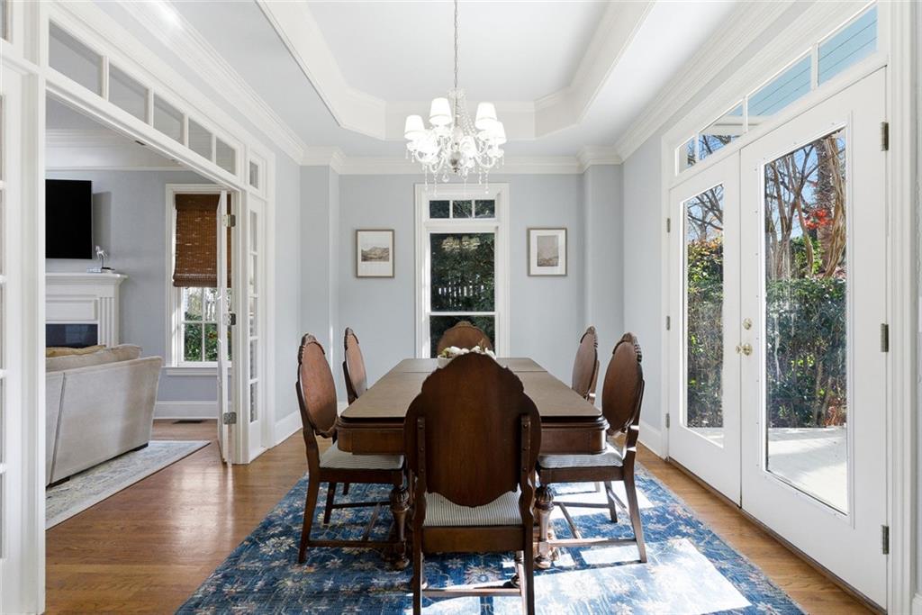 80 Fowler Avenue Roswell, GA 30075 - Photo 15 of 74 a dining room with furniture a chandelier and wooden floor