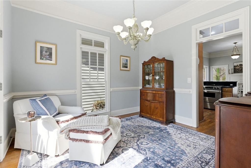 80 Fowler Avenue Roswell, GA 30075 - Photo 18 of 74 a living room with furniture and a chandelier