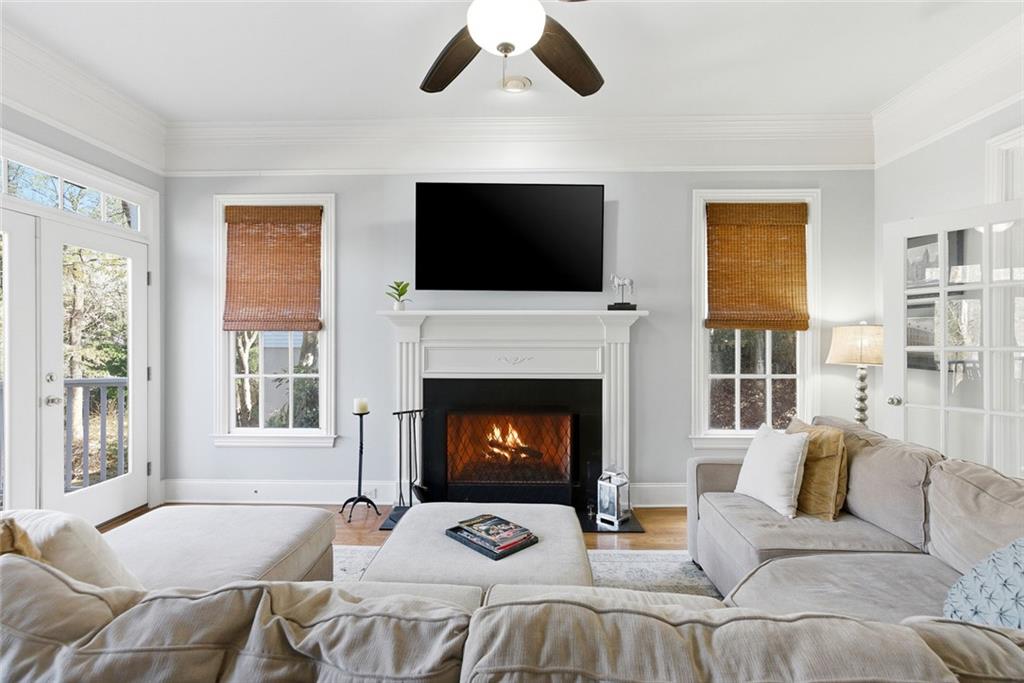 80 Fowler Avenue Roswell, GA 30075 - Photo 26 of 74 a living room with furniture a fireplace and a flat screen tv