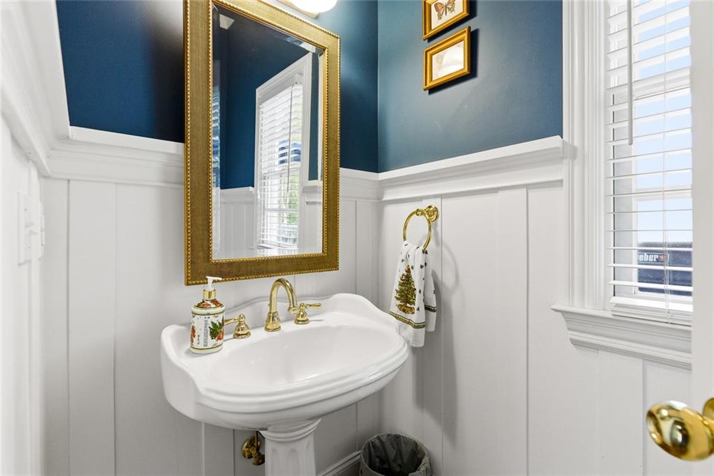 80 Fowler Avenue Roswell, GA 30075 - Photo 28 of 74 a bathroom with a sink a toilet and mirror