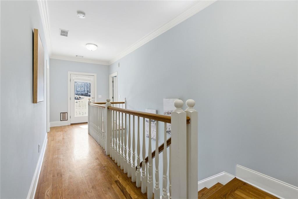 80 Fowler Avenue Roswell, GA 30075 - Photo 30 of 74 a view of a hallway with wooden floor and stairs
