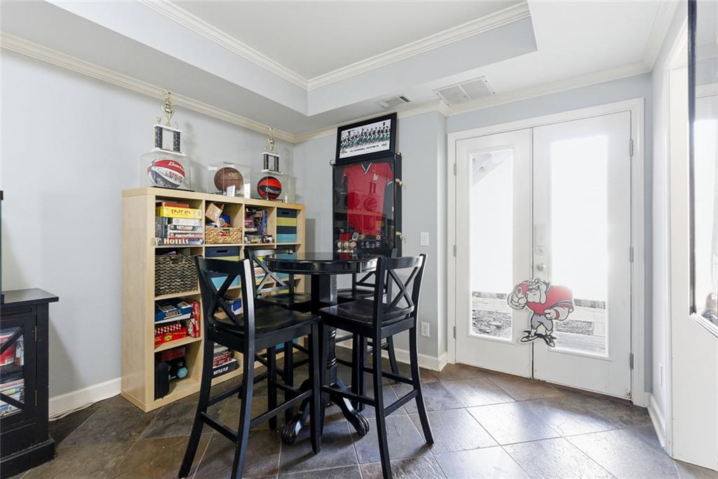 80 Fowler Avenue Roswell, GA 30075 - Photo 49 of 74 a view of a dining room with furniture and a window