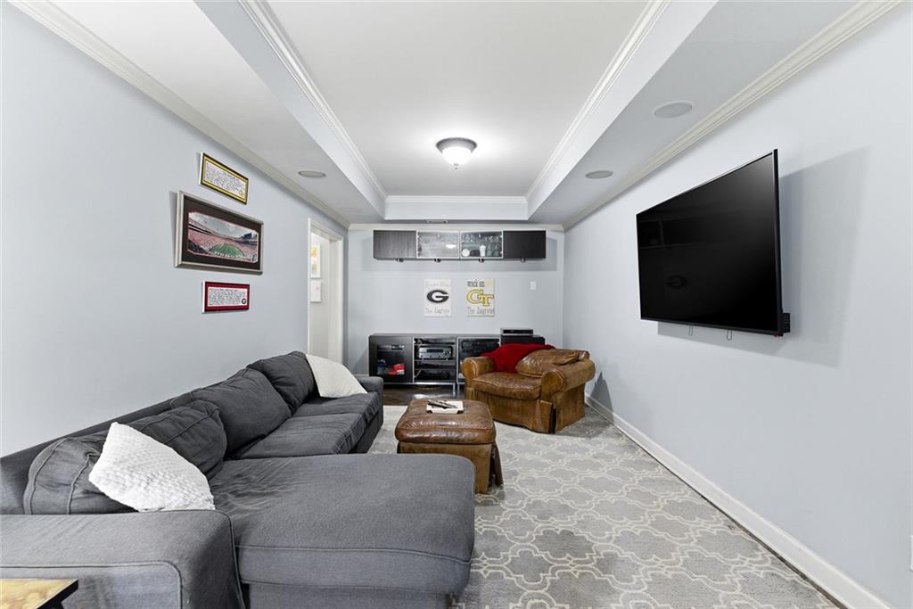 80 Fowler Avenue Roswell, GA 30075 - Photo 51 of 74 a living room with furniture and a flat screen tv