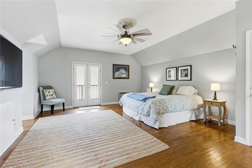 80 Fowler Avenue Roswell, GA 30075 - Photo 58 of 74 a bedroom with a bed ceiling fan and a window