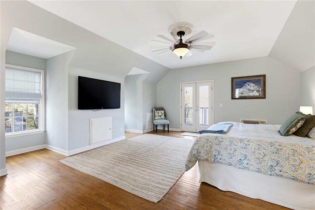 80 Fowler Avenue Roswell, GA 30075 - Photo 59 of 74 a bedroom with a bed and a flat screen tv