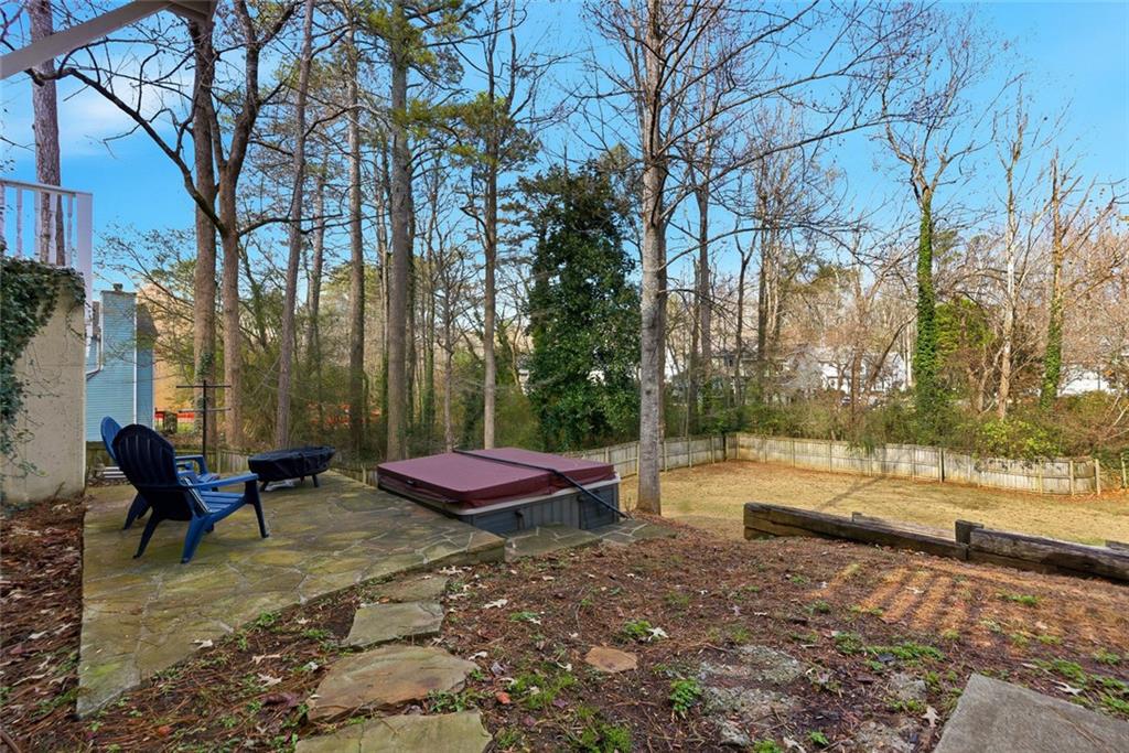 80 Fowler Avenue Roswell, GA 30075 - Photo 65 of 74 a view of a backyard with table and chairs under an umbrella