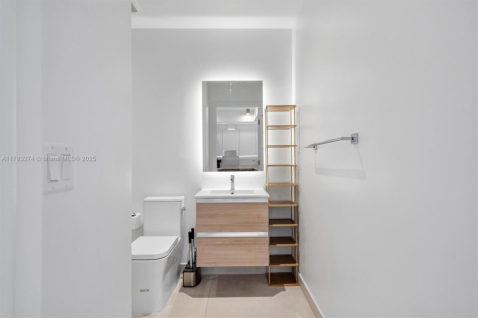 239 Southwest 9th Street, Unit 1704 Miami, FL 33130 - Photo 15 of 36 a bathroom with a sink toilet and mirror