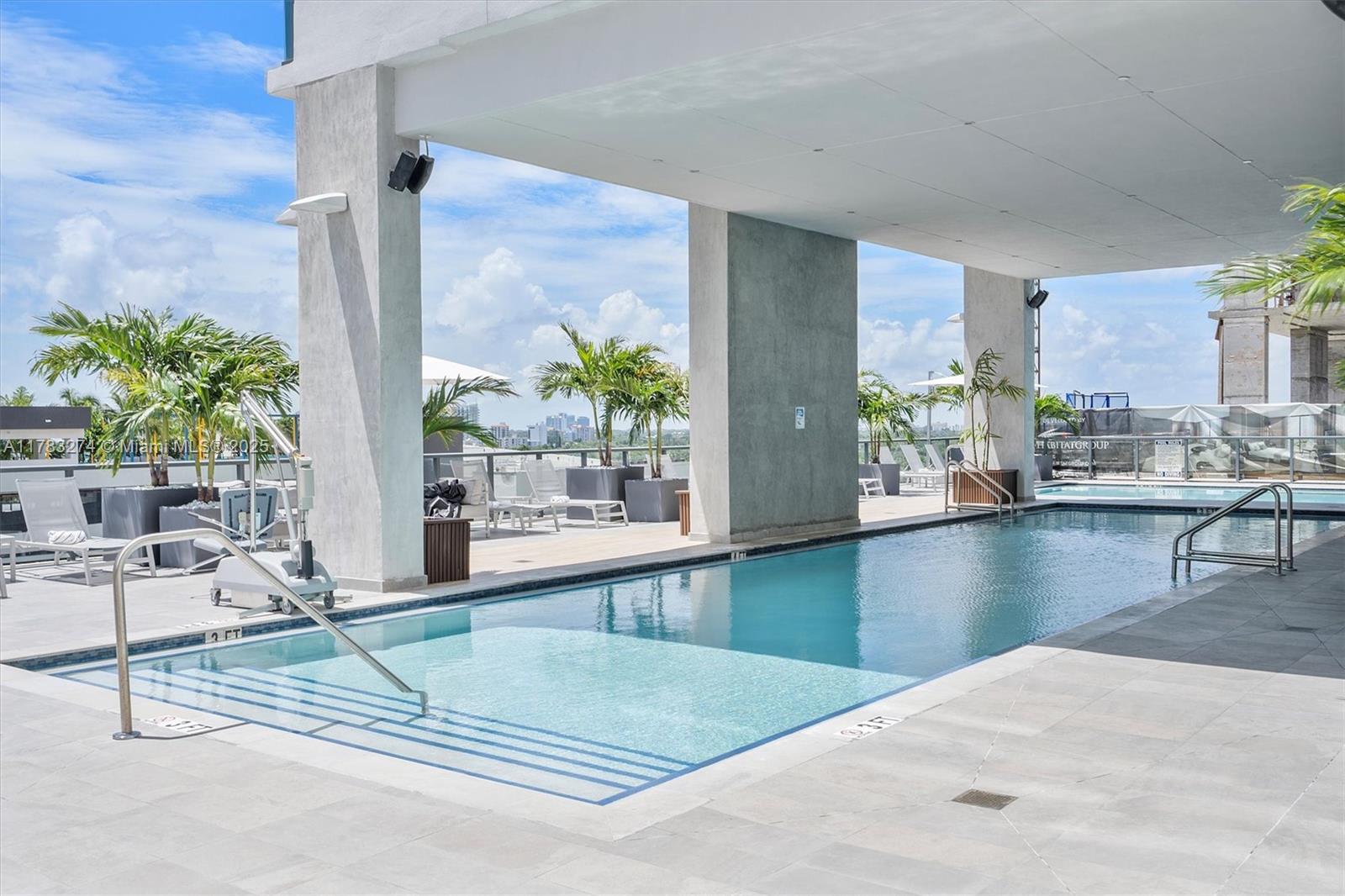 239 Southwest 9th Street, Unit 1704 Miami, FL 33130 - Photo 28 of 36 a living room with furniture and a floor to ceiling window