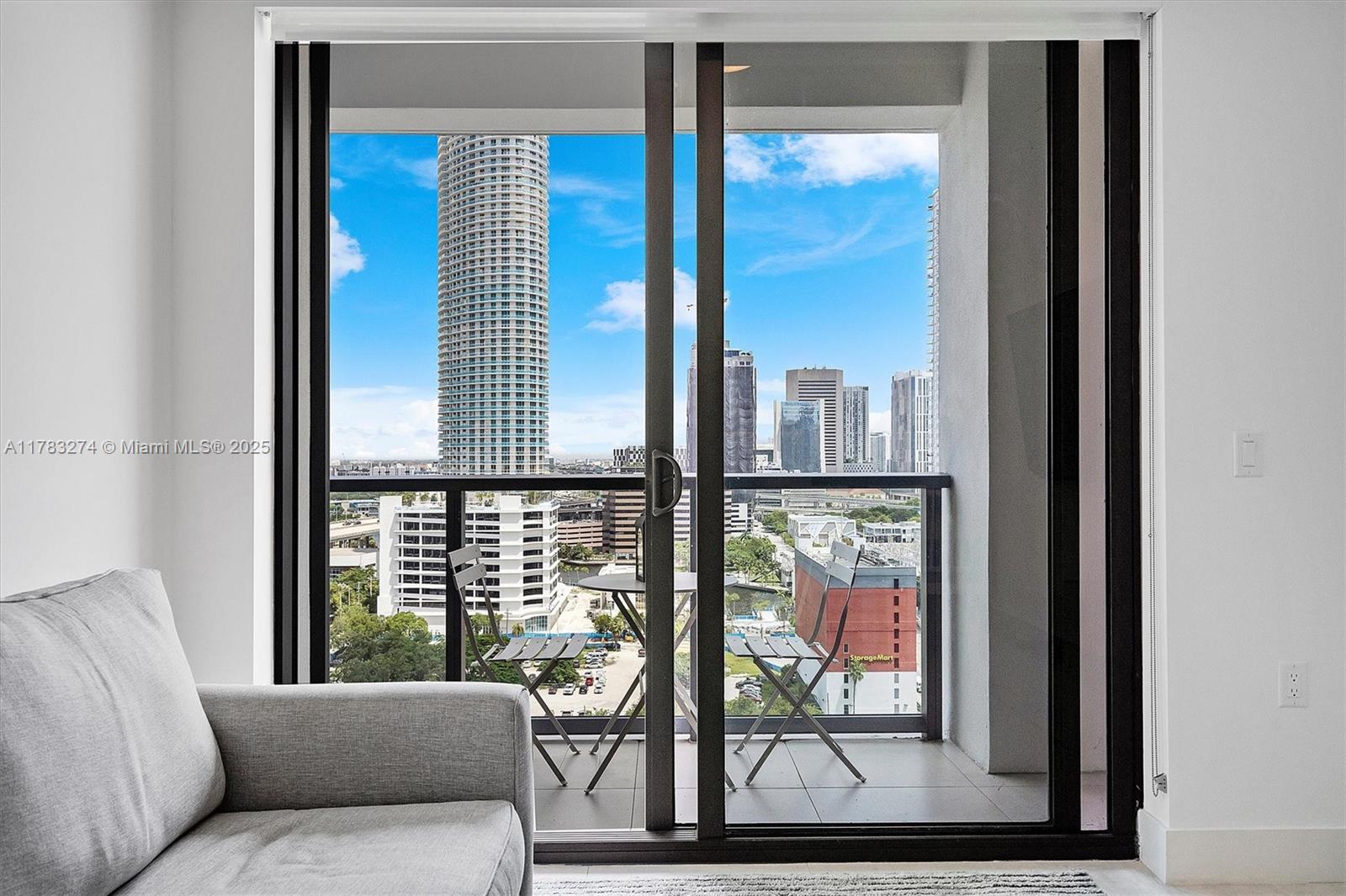 239 Southwest 9th Street, Unit 1704 Miami, FL 33130 - Photo 7 of 36 a living room with furniture and a window