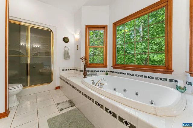 a view of a livingroom with furniture and staircase