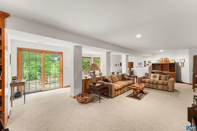 a kitchen that has a stove a table and chairs in it
