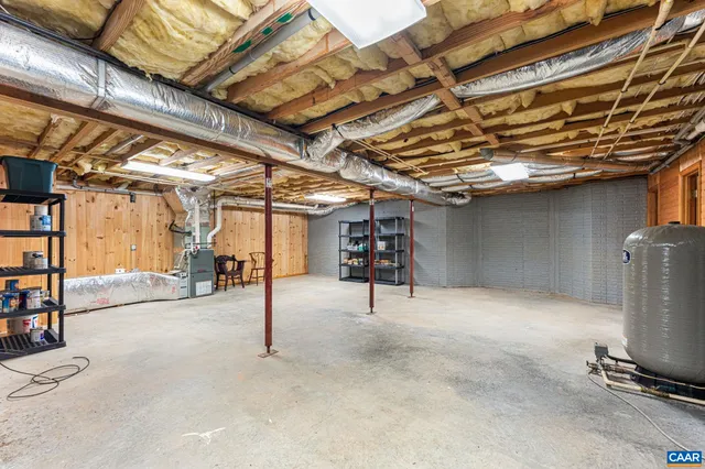 a view of a lush green forest with a houses