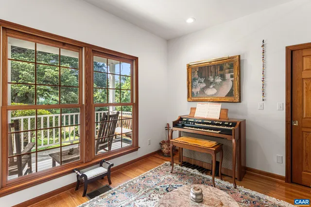 a living room with furniture a rug and a fireplace