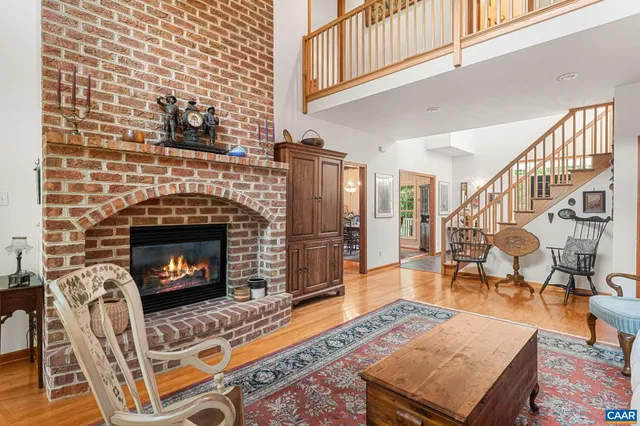 a living room with furniture rug and window