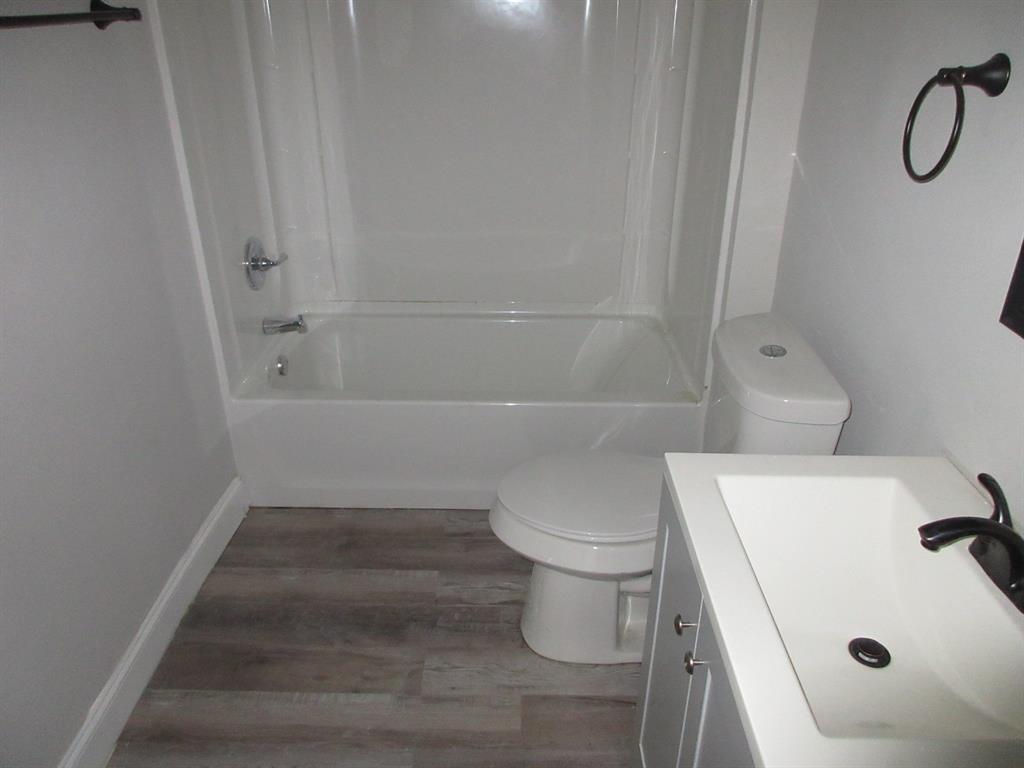 328 South Talton Street Minden, LA 71055 - Photo 12 of 21 a bathroom with a sink a toilet and shower