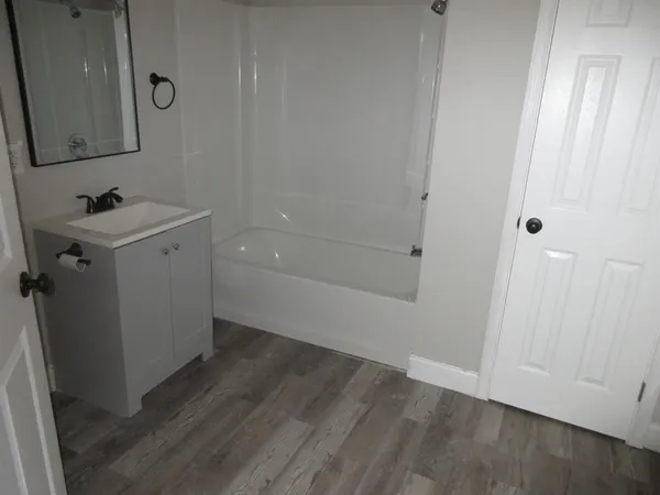 a bathroom with a sink and mirror