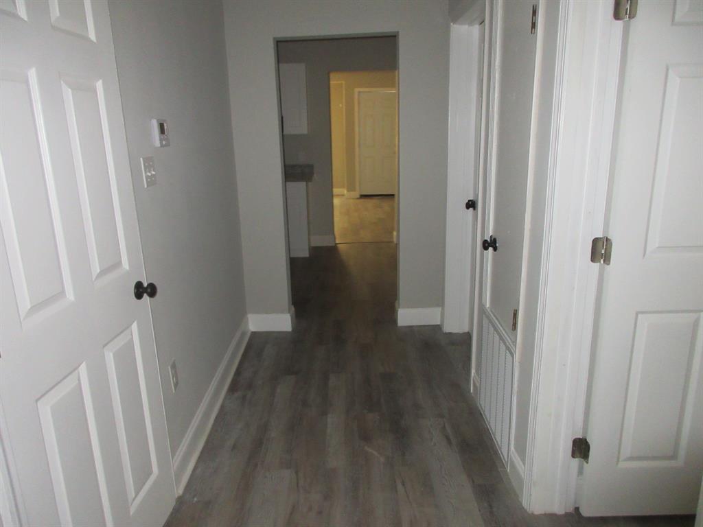 328 South Talton Street Minden, LA 71055 - Photo 15 of 21 a view of a hallway with wooden floor