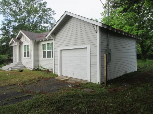 a view of a backyard of the house