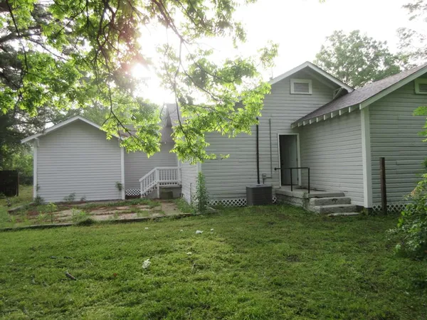 a backyard of a house with lots of green space